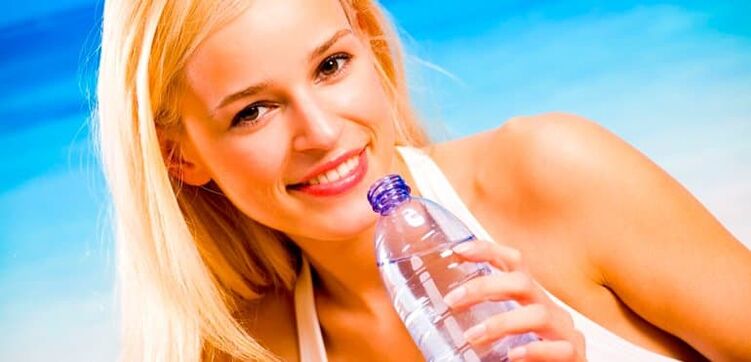 girl drinking water on an alcoholic diet